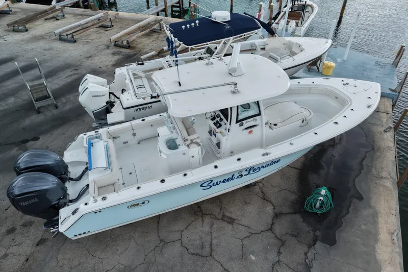  Yacht Photos Pics 2021 Sea Hunt Gamefish 30 Coffin Box boat docked, featuring dual Yamaha engines.