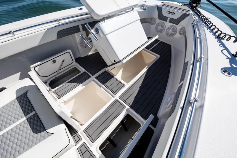  Yacht Photos Pics 2022 Invincible 33 Open Fisherman boat interior with storage compartments and seating.
