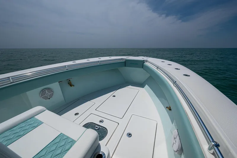  Yacht Photos Pics 2023 SeaHunter 31 Tournament boat deck with ocean view under cloudy sky.