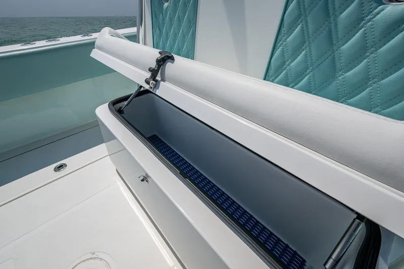  Yacht Photos Pics 2023 SeaHunter 31 Tournament boat with open storage compartment and quilted seating.