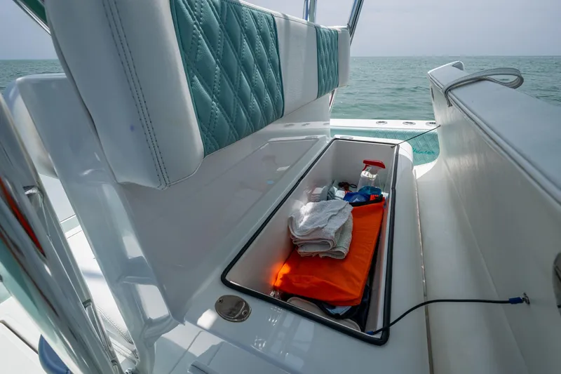  Yacht Photos Pics Storage compartment on 2023 SeaHunter 31 Tournament boat with towels and supplies.