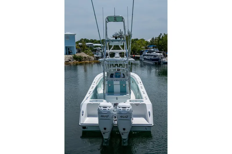  Yacht Photos Pics 2023 SeaHunter 31 Tournament boat with dual engines, docked in a serene marina.