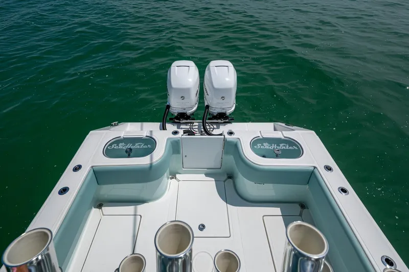  Yacht Photos Pics 2023 SeaHunter 31 Tournament boat with dual engines on calm water.