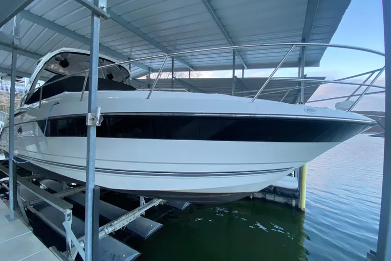  Yacht Photos Pics 2017 Monterey 355 Sport Yacht docked under a covered marina.