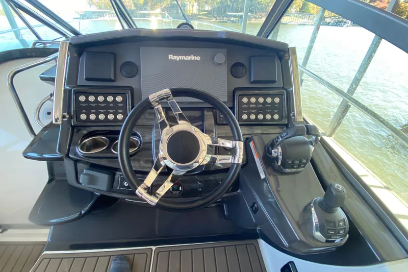 Yacht Photos Pics Cockpit of 2017 Monterey 355 Sport Yacht with steering wheel and control panel.