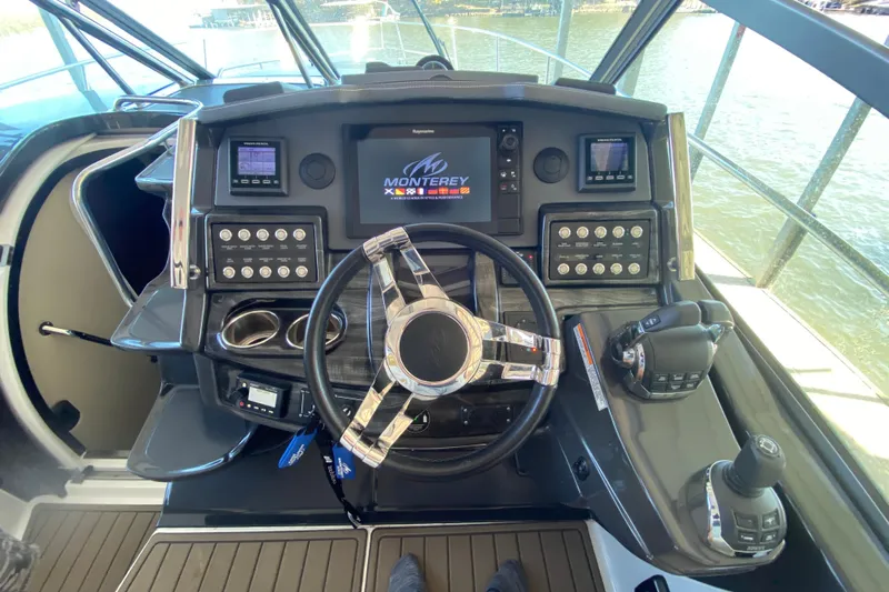  Yacht Photos Pics Cockpit of 2017 Monterey 355 Sport Yacht with advanced navigation controls and steering wheel.