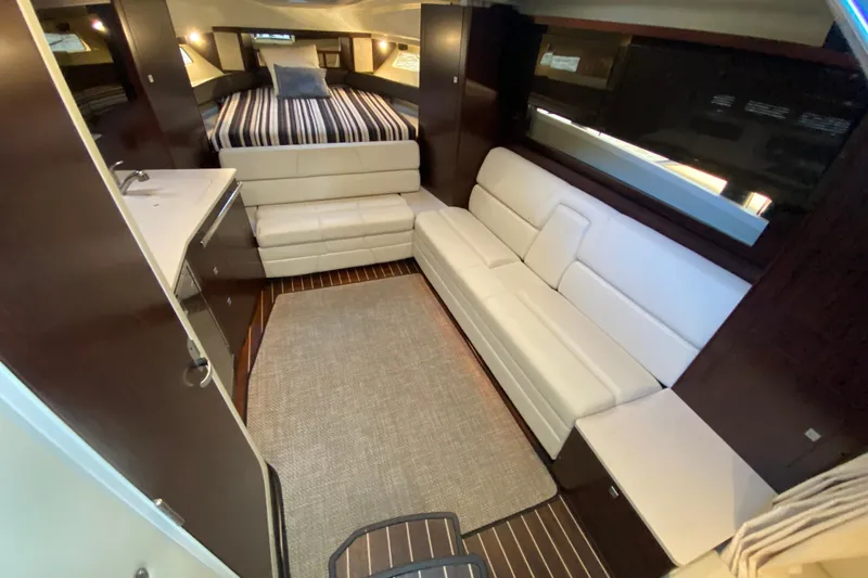  Yacht Photos Pics Luxurious interior of 2017 Monterey 355 Sport Yacht with white leather seating and modern design.
