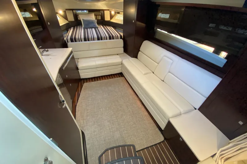  Yacht Photos Pics Luxurious interior of 2017 Monterey 355 Sport Yacht with modern seating and cozy bed.