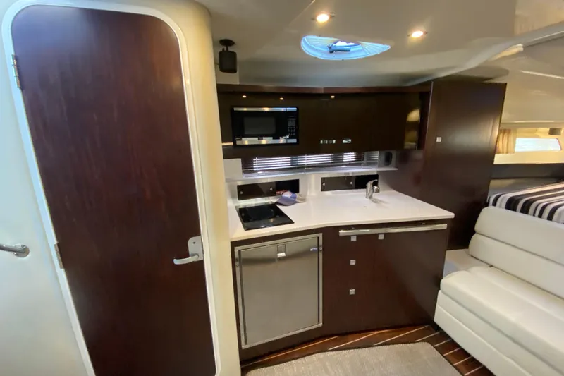  Yacht Photos Pics 2017 Monterey 355 Sport Yacht interior with modern kitchen and sleek cabinetry.
