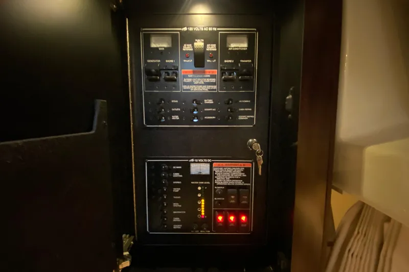  Yacht Photos Pics Electrical panel inside 2017 Monterey 355 Sport Yacht, featuring various switches and controls.