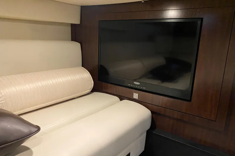  Yacht Photos Pics Luxurious interior of 2017 Monterey 355 Sport Yacht with plush seating and flat-screen TV.