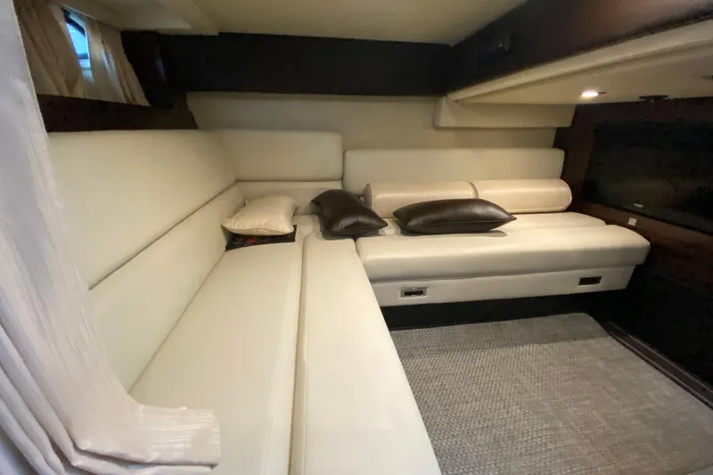  Yacht Photos Pics Luxurious interior of 2017 Monterey 355 Sport Yacht with cream leather seating and cushions.