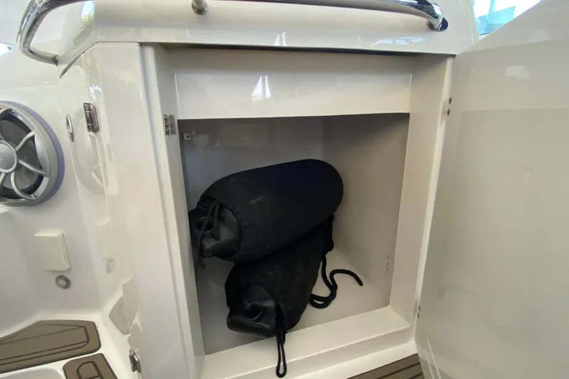  Yacht Photos Pics Storage compartment on 2017 Monterey 355 Sport Yacht with black fenders inside.