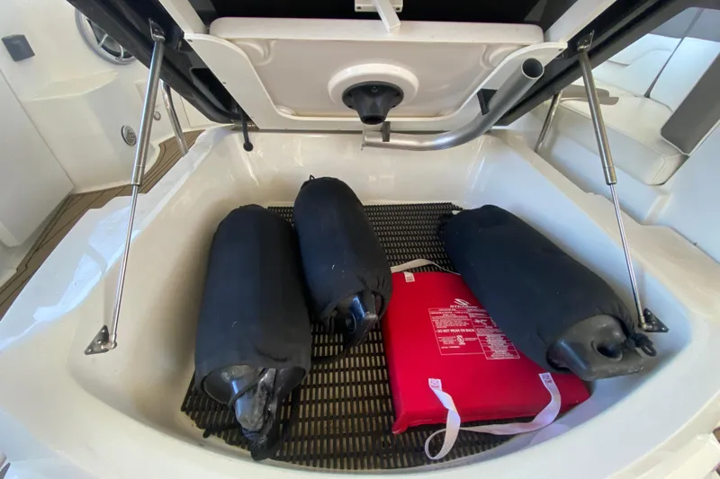  Yacht Photos Pics Storage compartment of 2017 Monterey 355 Sport Yacht with fenders and safety equipment.