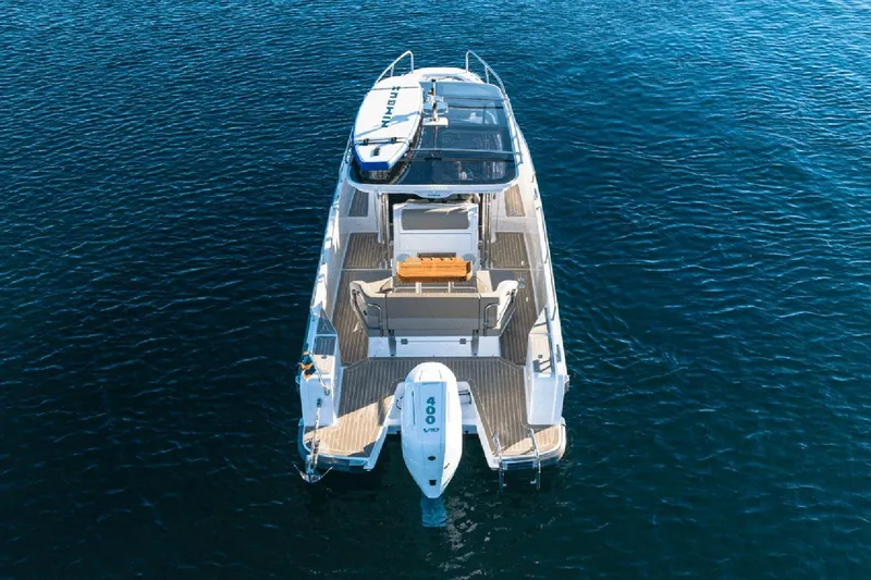  Yacht Photos Pics Nimbus T9 2025 motorboat on clear blue water, aerial view.