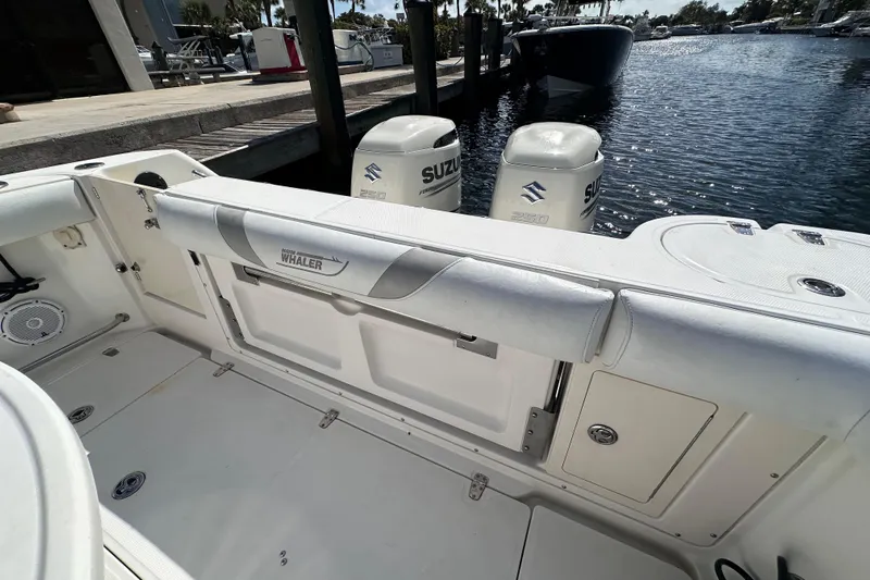  Yacht Photos Pics 2006 Boston Whaler 285 Conquest boat interior with Suzuki engines at dock.