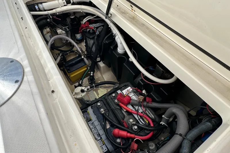  Yacht Photos Pics 2006 Boston Whaler 285 Conquest engine compartment with visible wiring and battery setup.