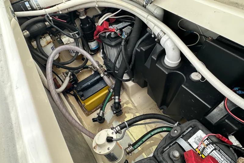  Yacht Photos Pics Engine compartment of a 2006 Boston Whaler 285 Conquest, showcasing wiring and components.