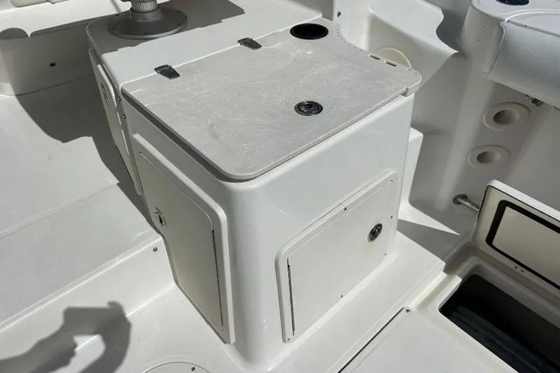  Yacht Photos Pics 2006 Boston Whaler 285 Conquest boat interior with storage compartments and seating.