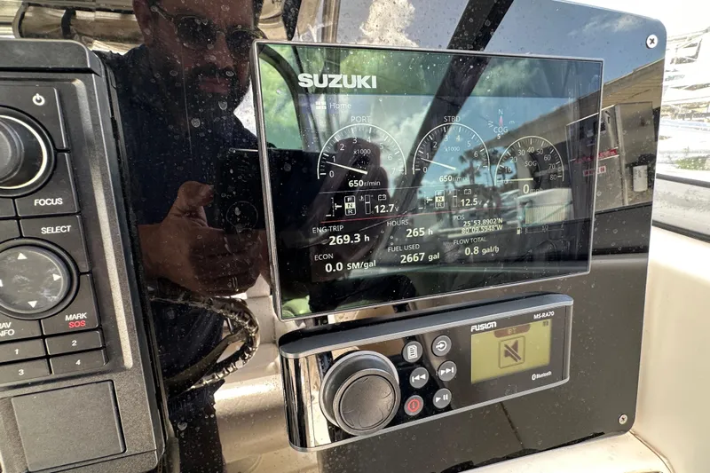  Yacht Photos Pics Control panel of a 2006 Boston Whaler 285 Conquest boat with Suzuki display.