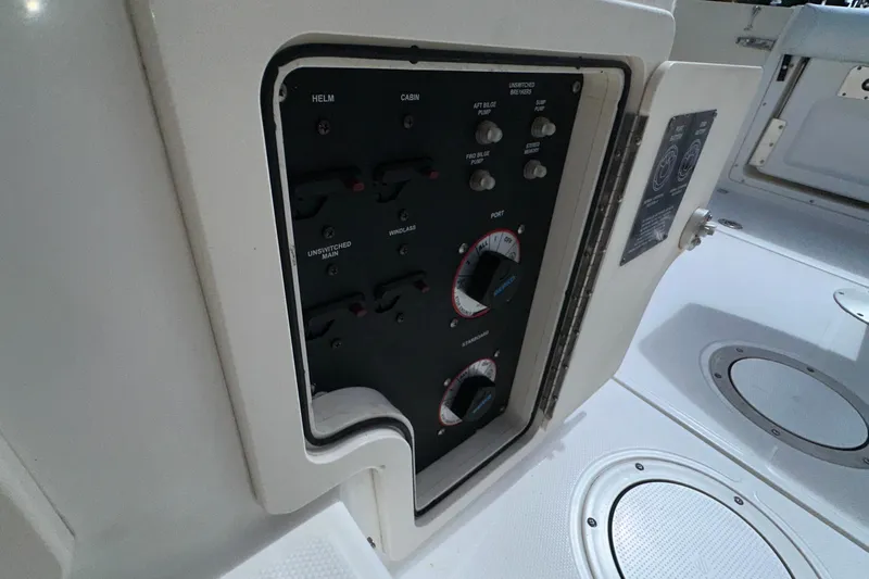  Yacht Photos Pics Control panel on a 2006 Boston Whaler 285 Conquest boat, featuring various switches and dials.