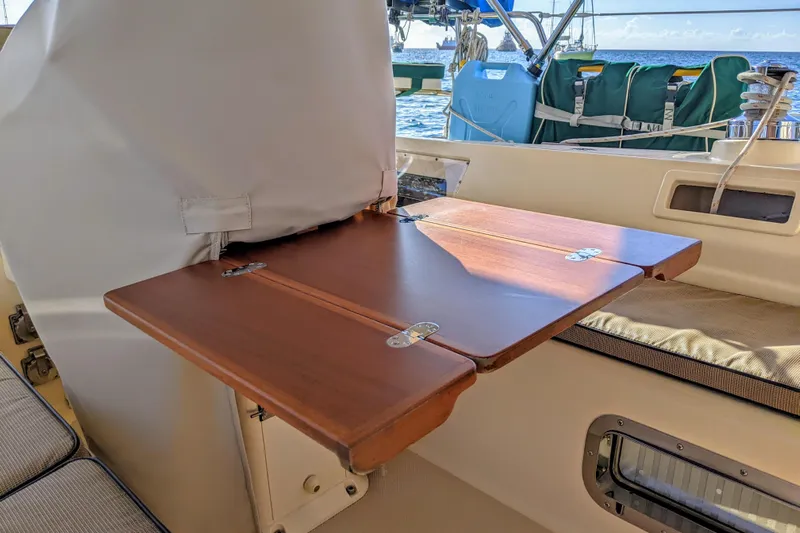 Open Agenda Yacht Photos Pics Foldable wooden table on 2006 Island Packet 370 sailboat deck.