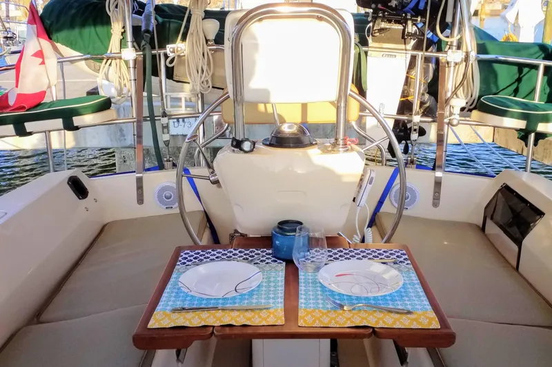 Open Agenda Yacht Photos Pics Cockpit of 2006 Island Packet 370 sailboat with table set for two.