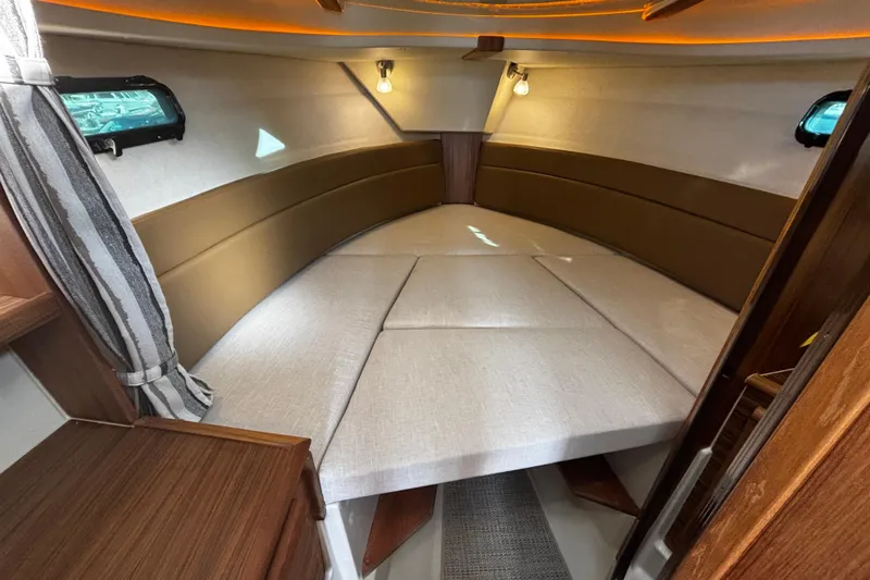  Yacht Photos Pics Interior of 2026 Ranger Tugs R-27 with cozy sleeping area.