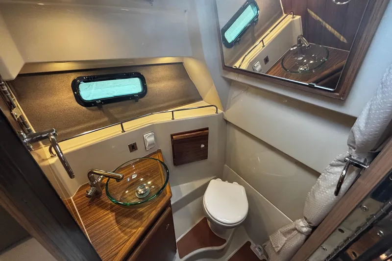  Yacht Photos Pics Interior view of bathroom in a 2026 Ranger Tugs R-27 boat.
