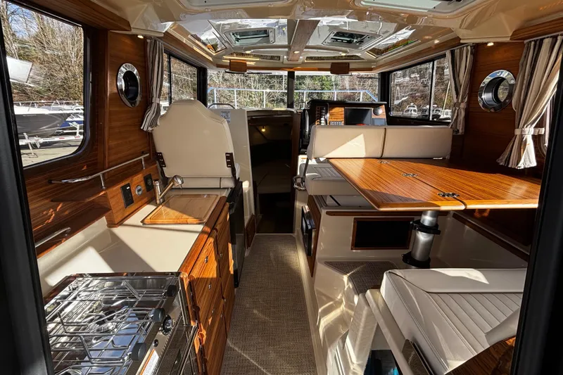  Yacht Photos Pics Interior of 2026 Ranger Tugs R-27 yacht with elegant wood finish.