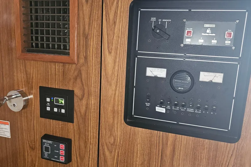  Yacht Photos Pics Control panel of a 2009 Pursuit OS 315 Offshore boat with wood finish.