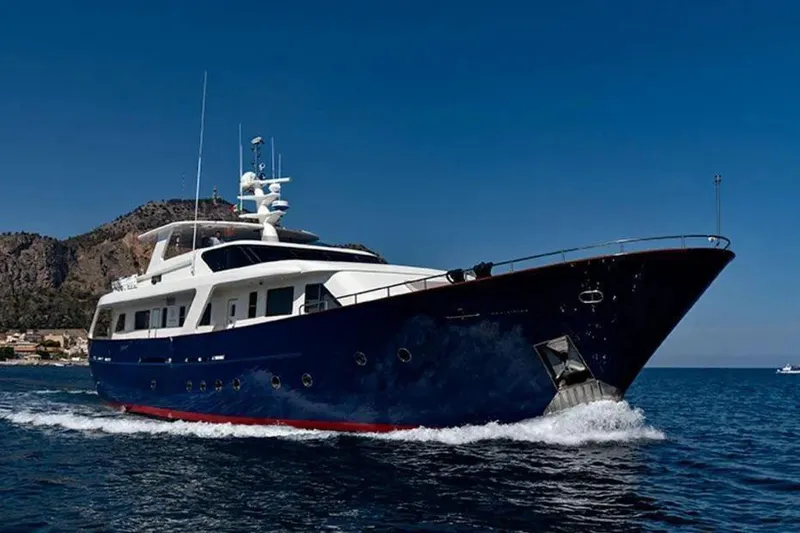  Yacht Photos Pics Luxury yacht Benetti Sail Division 105, 2002 model, cruising on open sea.