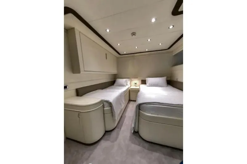  Yacht Photos Pics Luxurious twin cabin interior on 2002 Benetti Sail Division 105 yacht.