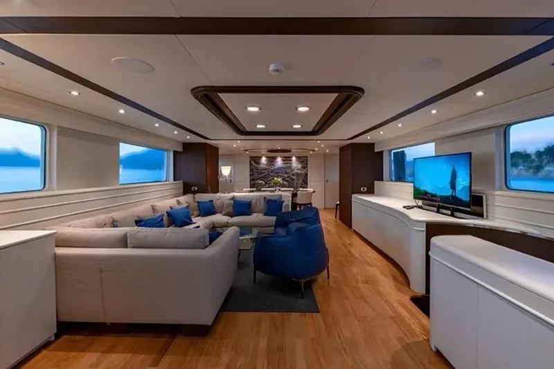  Yacht Photos Pics Luxurious interior of 2002 Benetti Sail Division 105 yacht with elegant seating and modern decor.