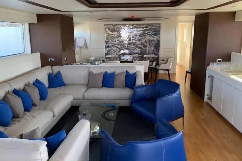  Yacht Photos Pics Luxurious interior of 2002 Benetti Sail Division 105 yacht with modern seating and decor.