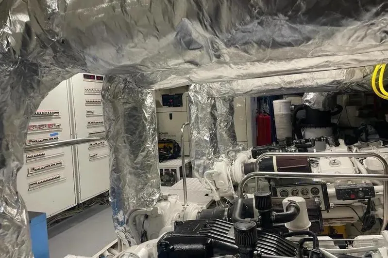  Yacht Photos Pics Engine room of 2002 Benetti Sail Division 105 yacht, featuring machinery and control panels.