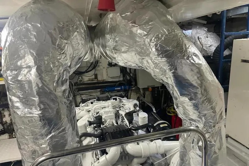  Yacht Photos Pics Engine room of 2002 Benetti Sail Division 105 yacht with insulated exhaust pipes.