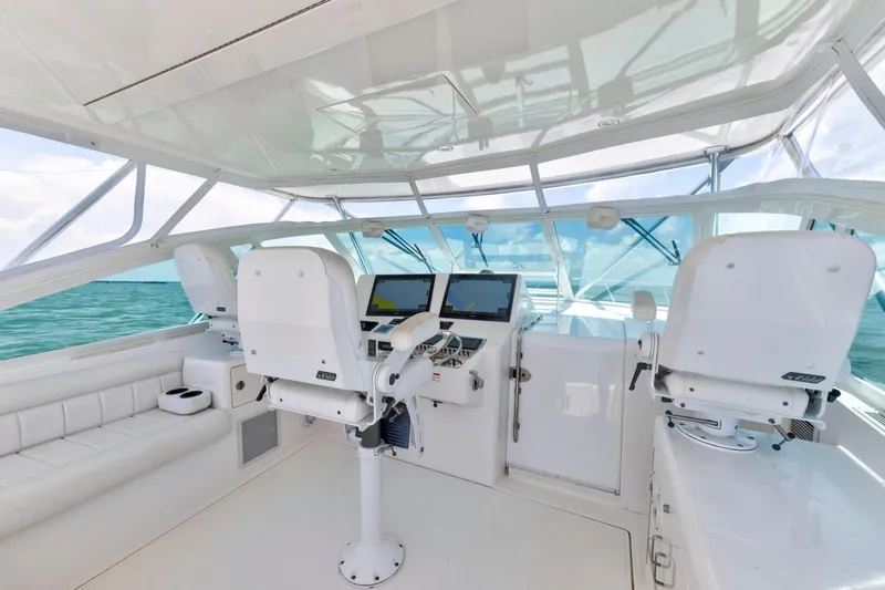  Yacht Photos Pics 2010 Cabo 45 Express yacht helm with modern navigation equipment and ocean view.