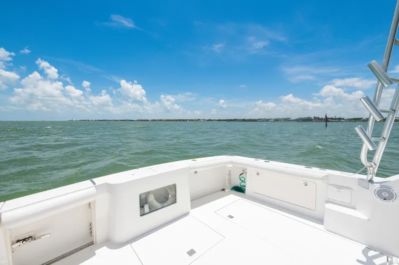  Yacht Photos Pics 2010 Cabo 45 Express boat deck with ocean view under clear blue sky.
