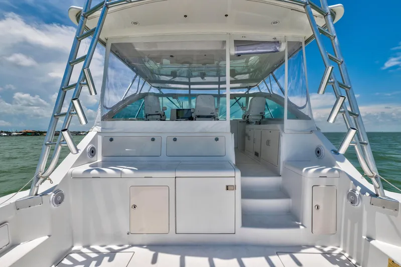  Yacht Photos Pics 2010 Cabo 45 Express yacht interior with seating, ocean view, and clear skies.