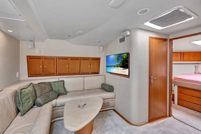  Yacht Photos Pics Luxurious interior of 2010 Cabo 45 Express yacht with cozy seating and modern amenities.