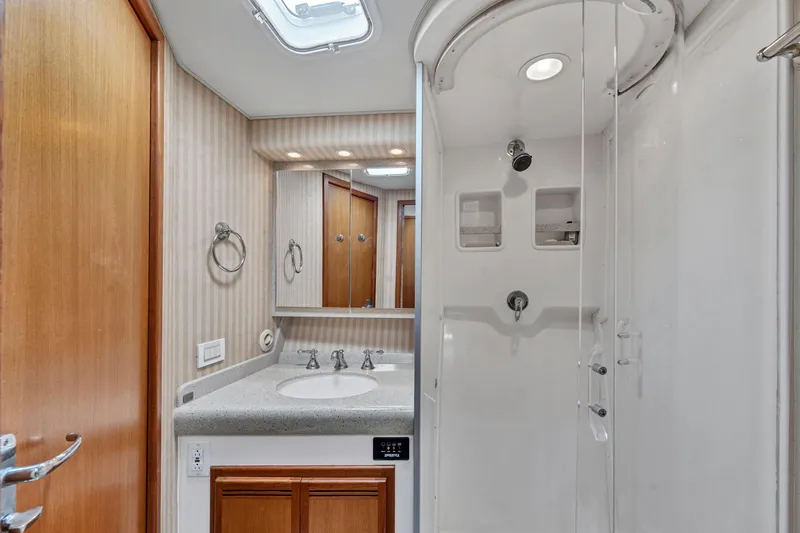 Yacht Photos Pics Luxurious 2010 Cabo 45 Express yacht bathroom with shower and vanity.