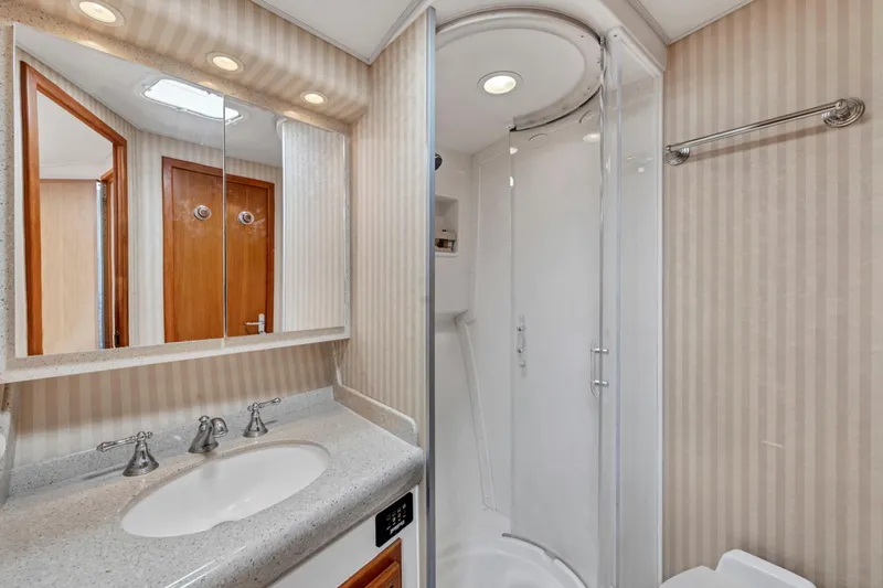  Yacht Photos Pics Luxurious bathroom in 2010 Cabo 45 Express yacht with modern fixtures and shower.