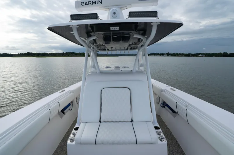Hoo Hunter Yacht Photos Pics 2012 SeaHunter 37 Tournament boat with white seating on calm water.