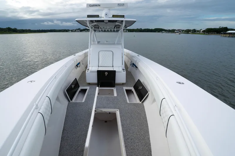 Hoo Hunter Yacht Photos Pics 2012 SeaHunter 37 Tournament boat interior with open storage compartments on calm water.