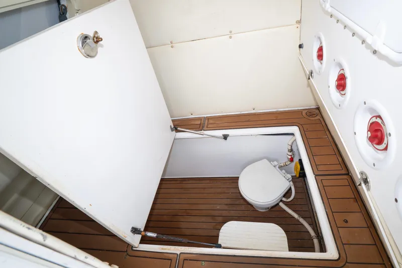 Hoo Hunter Yacht Photos Pics 2012 SeaHunter 37 Tournament boat interior with open hatch and marine toilet.