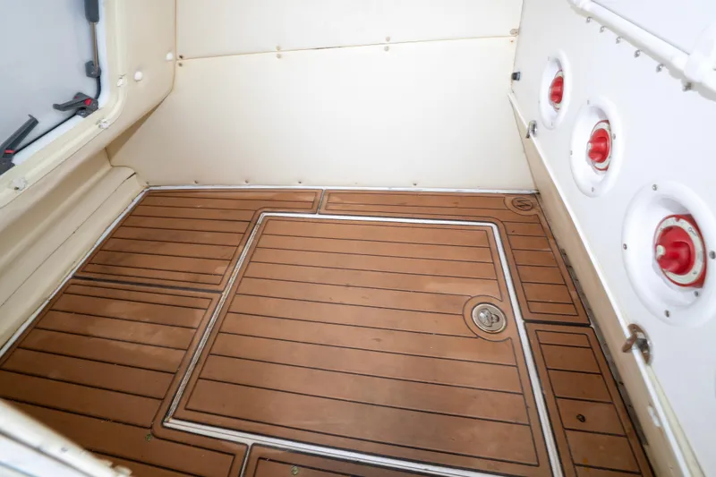 Hoo Hunter Yacht Photos Pics 2012 SeaHunter 37 Tournament boat interior with teak flooring and storage compartments.