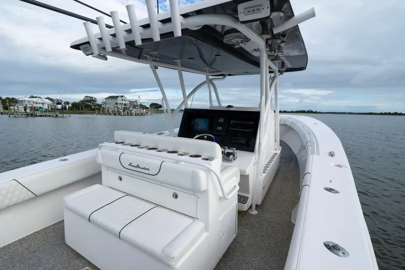 Hoo Hunter Yacht Photos Pics 2012 SeaHunter 37 Tournament boat interior with helm and seating, on calm water.