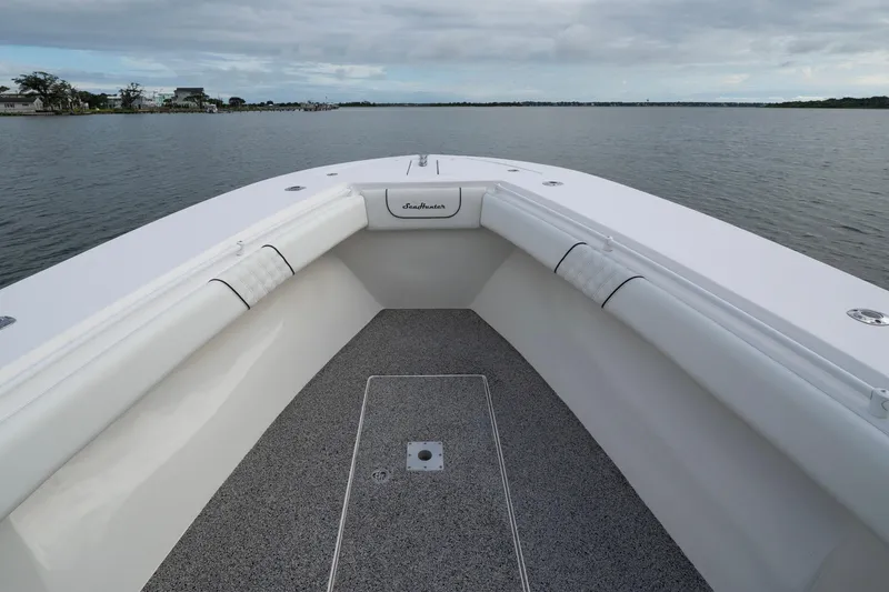 Hoo Hunter Yacht Photos Pics 2012 SeaHunter 37 Tournament boat deck with cushioned seating, overlooking calm waters.