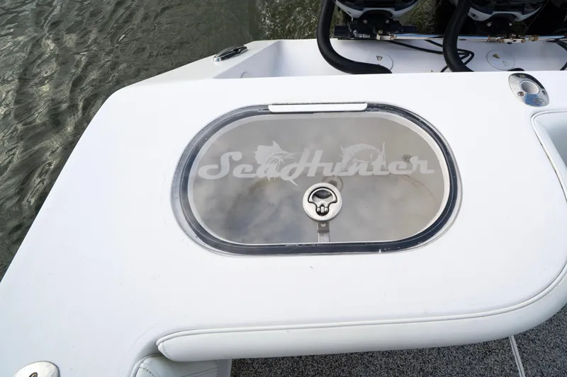 Hoo Hunter Yacht Photos Pics 2012 SeaHunter 37 Tournament boat livewell with logo, near water surface.